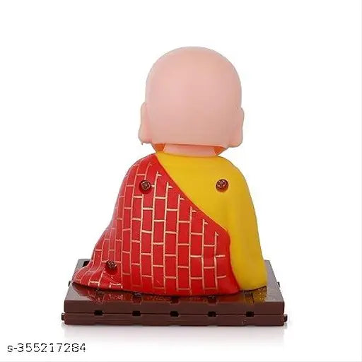 Multicolor solar-powered Buddha statue (9cm height), brings tranquility to car, office, or home decor. Eco-friendly, solar-powered design avoids batteries. India origin