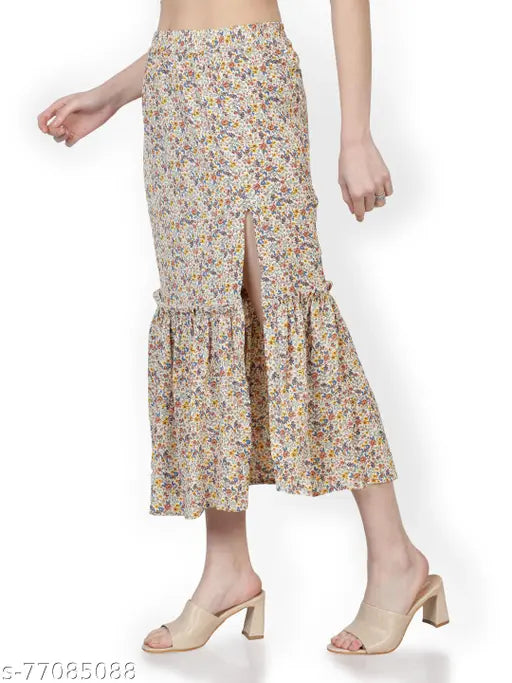 Floral printed polyester midi skirt with side slit & ruffles, elastic waistline. Sizes: 32 (30/28/42), 34 (32/28/44). Indian made