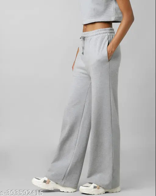 Grey high-waisted jogger sweatpants with pockets and drawstrings, perfect for workouts or relaxing