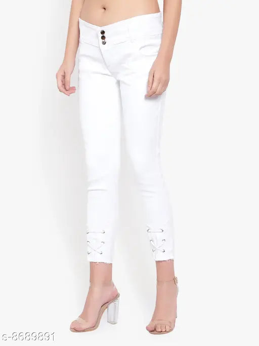 White denim skinny jeans with distressed knee details and silver studded belt loops