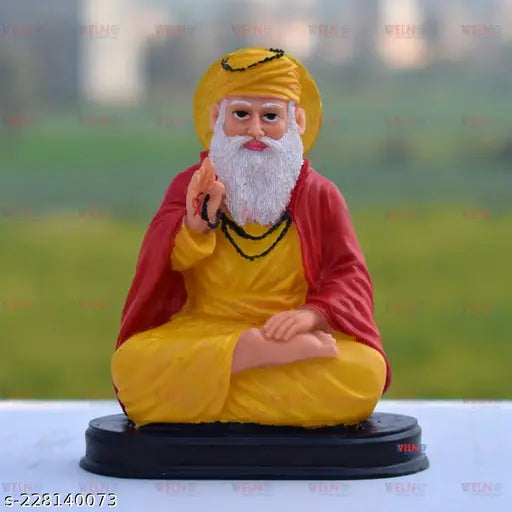 Delicate, graceful Delightful Guru Nanak Ji idol, intricately crafted Indian religious artifact with beaded strings, showcasing the seated spiritual leader in peaceful meditation