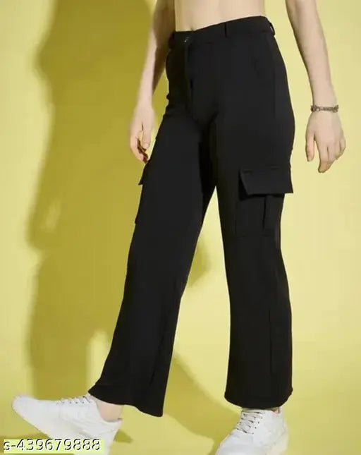 Black cargo pants with large pockets, elastic waistband, rolled up legs