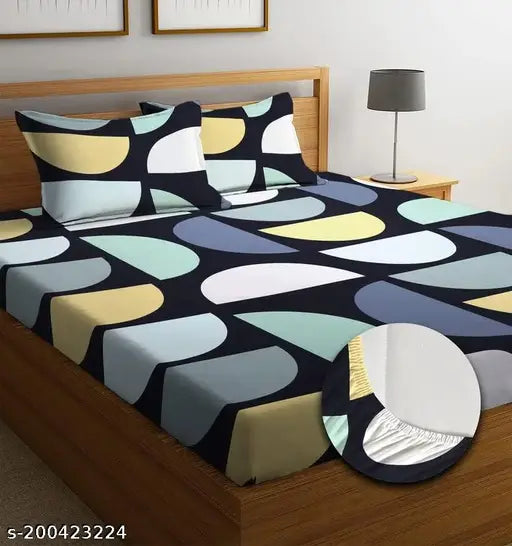 Printed cotton double bedsheet with 2 pillow covers, teal and beige pattern.