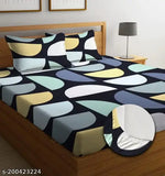Printed cotton double bedsheet with 2 pillow covers, teal and beige pattern.