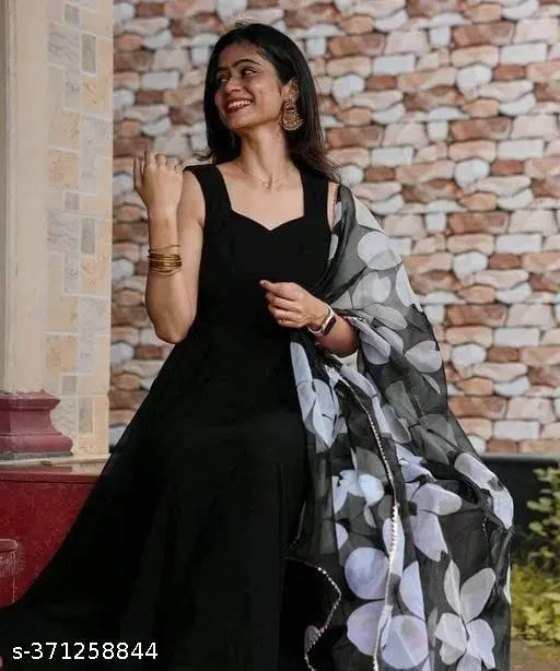Black georgette sleeveless blouse with floral print, black flower design on chest area