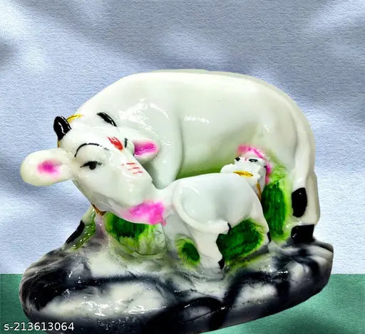 Gopal Kamdhenu figurine, ceramic material, depicts cows and child at home office setting