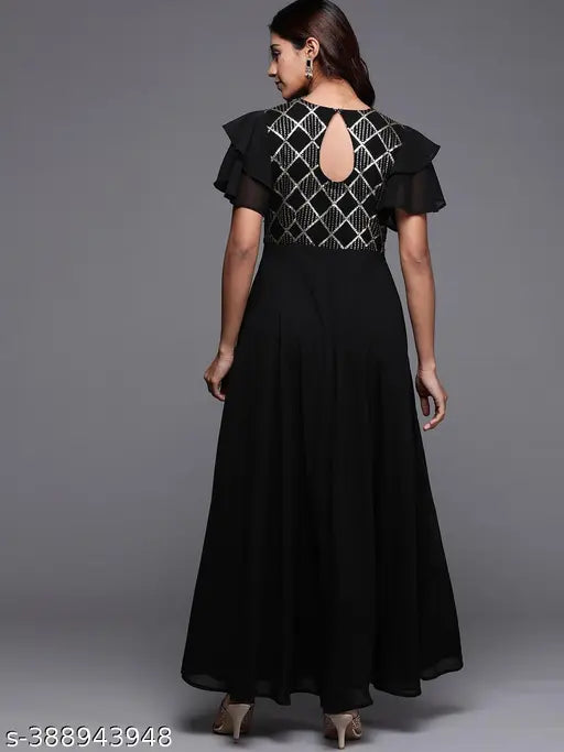 Black, solid-tone maxi dress with round neckline, keyhole detailing at the back, and statement ruffled sleeves. Ideal for festive occasions