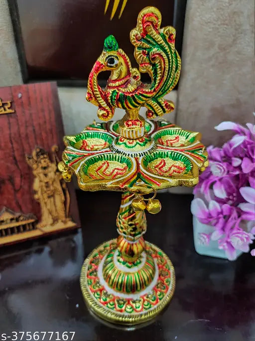 Multi-color peacock metal diya stand, Indian handicraft artifact for home decor & gift item, showcasing intricate design in 10cm x 21cm x 10cm size