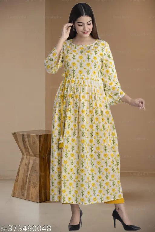 Women's rayon three-quarter sleeve printed cotton kurta, vibrant Indian fashion on hanger