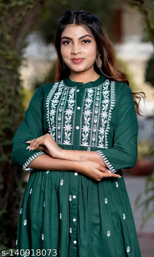 Green rayon three-quarter sleeve cotton kurti for women, embroidered print design by CYNCA. Indian women's long kurti on display