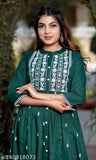Green rayon three-quarter sleeve cotton kurti for women, embroidered print design by CYNCA. Indian women's long kurti on display