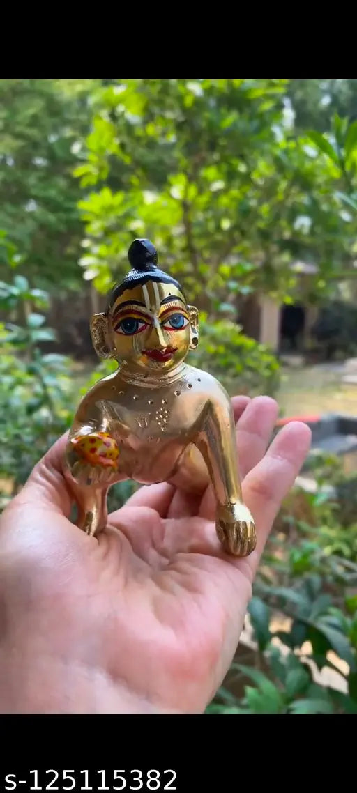 Hand-painted brass Krishna idol, modern Laddoo Gopal Ji figure with Netr Shringar and gold color detailing. Size: 8x5x8 cm, ideal for home decor or office table sculpture