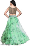 Green embroidered semi-stitched lehenga choli set on display, featuring floral patterns and net fabrics