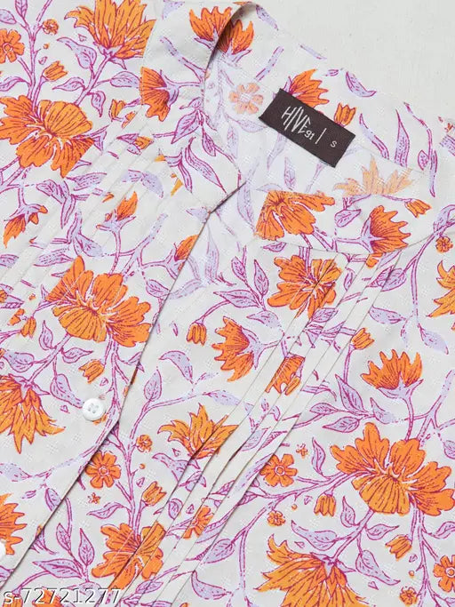 Pink rayon floral top and tunic with 3/4 sleeves, printed pattern, front button closure, and waist belt. Made in India