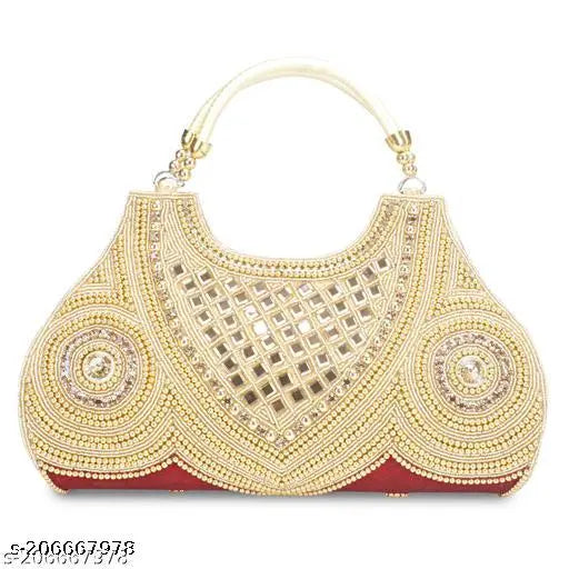 A fancy, ornate womens clutch with a decorative border and intricate detailing