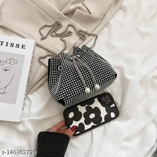 Black rhinestone bucket bag with flap closure