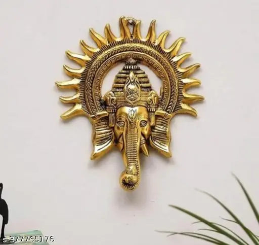 Golden brass Ganesh idol wall hanging, sun-accented decorative showpiece for festival home or Pooja room, 4cm x 23cm x 19cm from India