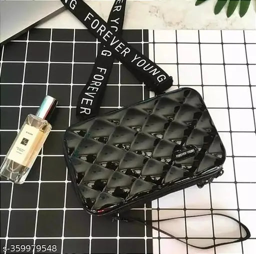 Sleek black leather zippered sling bag with a quilted pattern, perfect for travel or everyday use