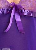 Purple lace babydoll lingerie with satin ribbon, dark blue fabric.