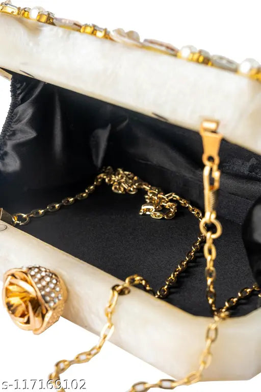 Handicraft clutch with metallic finish and crystal embellishments
