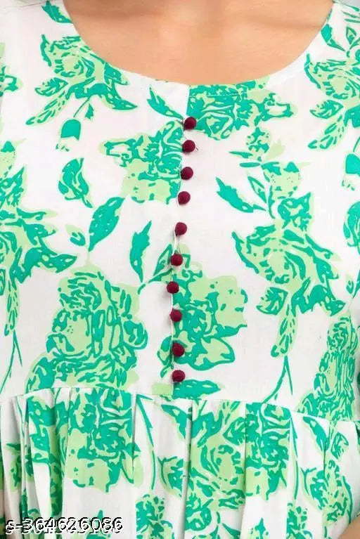 Green rayon Anarkali kurti with floral print, three-quarter sleeves. Single size: M (38in bust), L (40in bust), XL (42in bust), XXXL (46in bust). Indian fashion for women on display