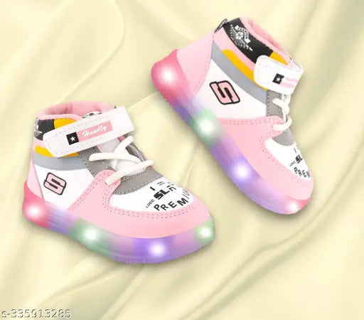 Pink and white kids' casual light-up shoes with Velcro closures
