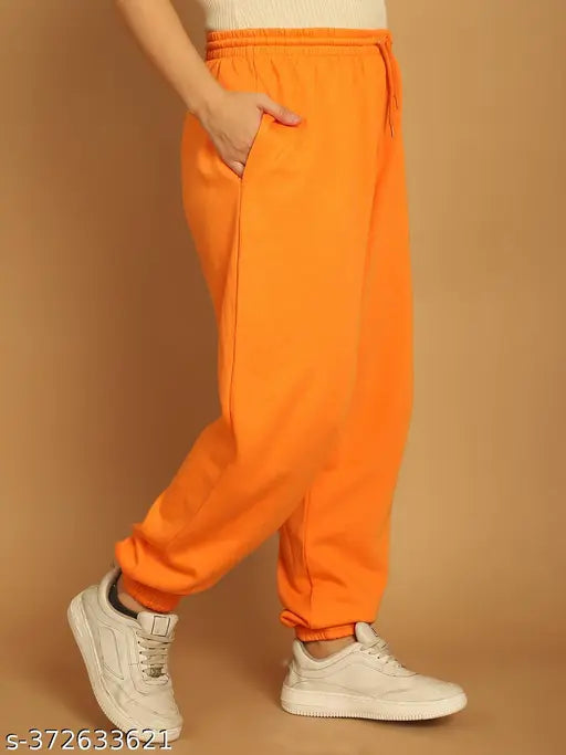 Orange nylon solid jogger pants by NOBARR, ankle-length with drawstring detail and elasticated waistline, made in India
