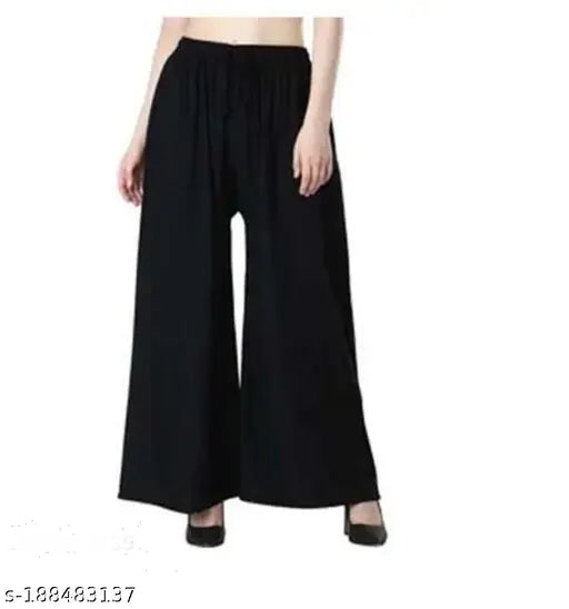 Green cotton palazzo pants with a relaxed fit, suitable for women and girls for both day and night wear
