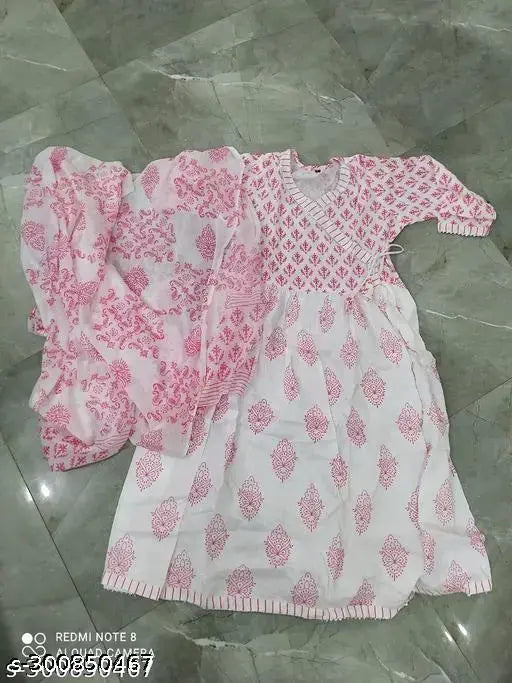 Pink rayon Anarakali kurti with dupatta, three-quarter sleeves, printed combo on chitrakara motifs. India-made women's fashion set displayed on mannequin