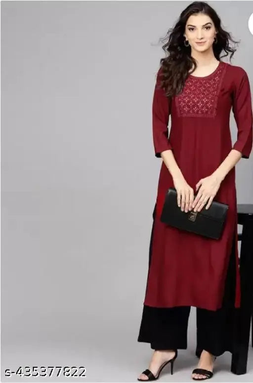 Maroon rayon kurta with black palazzo set, embroidered net design, suitable for women's casual or festive wear