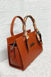 Stylish sling handbag in brown, featuring flap closure and multiple pockets