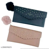 Black leather clutch, ruffle detailing, with round studs on straps and fringe accents