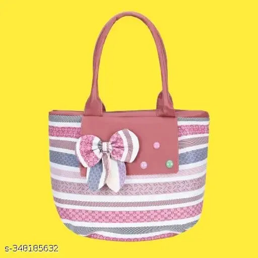 Red and white striped fabric tote, with large bow, pink polka dots, and multiple pockets or compartments