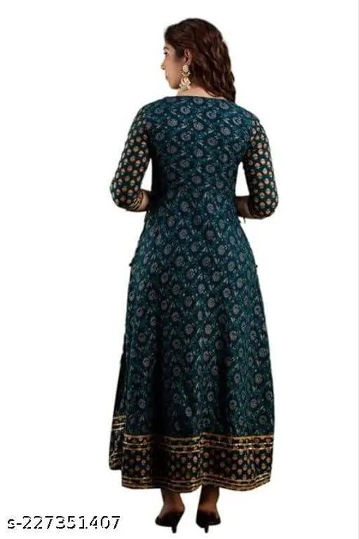 Anarkali kurta with printed ethnic motifs in teal blue color on a woman's body, full sleeves, embroidery at border