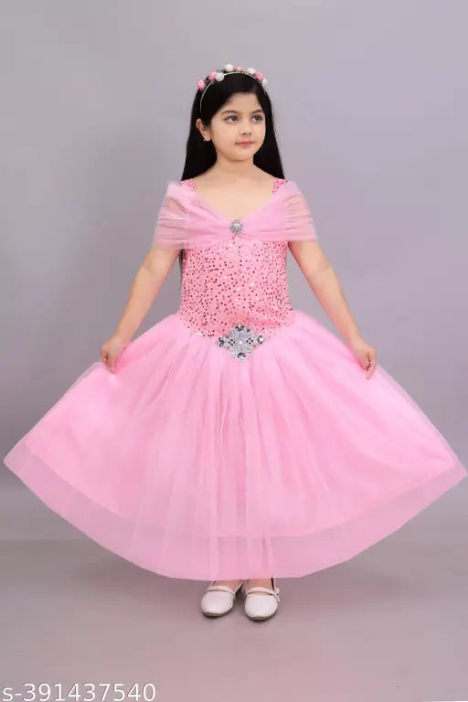 Pink tulle princess ball gown dress with ruffled skirt and silver tiara