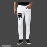 White cotton slim fit pants with a large graphic of a brown teddy bear on the left leg