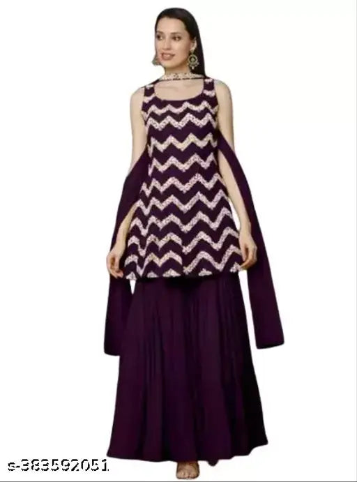 Purple lehenga with long ruffled skirt and matching dupatta, intricate heavy embroidery on kurta and dupatta