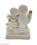 White idol depicting Lord Shiva, Lord Ganesh, and Maa Parvati, with gold accents and small temple flags