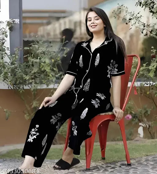 Black cotton nightsuit set for women, featuring a printed kaftan-style top and matching pyjama bottoms with elastic waist and drawstring. Ideal for comfortable sleepwear or loungewear. Made in India