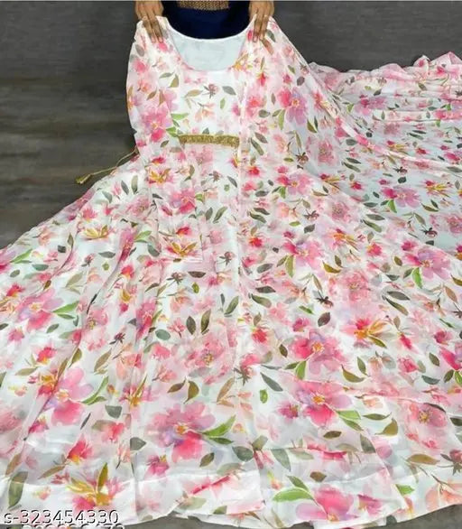 White Georgette Anarkali Gown Set with Duppatta, featuring long sleeves and a beautiful pink floral print. Women's formal wear for festivals or weddings, available in various sizes from S to XXXL. Made in India