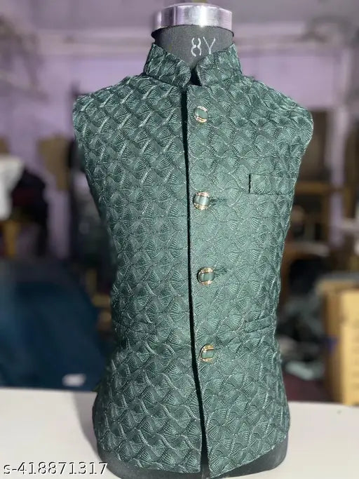 A navy blue patterned waistcoat, part of the Nadwi Garments collection, for young boys