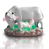 Resin cow with calf idol, symbolizing prosperity & love. Handmade decorative figurine, ideal for home, office, or gifting. Size: 19.5 cm (L) x 12 cm (H) x 12 cm (B). May slightly vary in color due to lighting or monitor settings. Origin: India