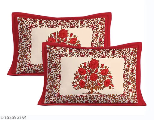 Red floral cotton double bedsheet with intricate design and red border.
