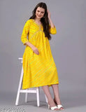 Yellow midi dress with horizontal striped pattern, long sleeves, and V-neck