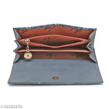 The product is an open clutch with a chain lock mechanism, lined in blue fabric, featuring a single metallic key ring