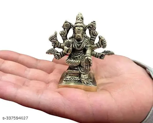 Brass 8-handed Varahi Amman idol/statue, depicts Lord Vishnu's Varaga Avatar, boar face, human body, weapons, seated position. Handcrafted Indian brass statue for spiritual protection