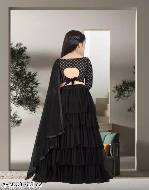 Semi-stitched ruffle and embroidered kid's lehenga choli set, made from 100% good quality net and satin fabrics. Available in sizes ranging from 2-3 to 15 years old