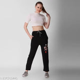 Black women's cropped crop top and high-waisted jogger with heart graphic
