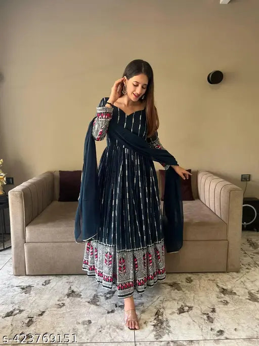 Designer blue Anarkali suit with striped net pattern, georgette fabric, and three-quarter sleeves. Available in sizes S, M, L, XXL. Get ready for parties with this fashionable Indian party wear!