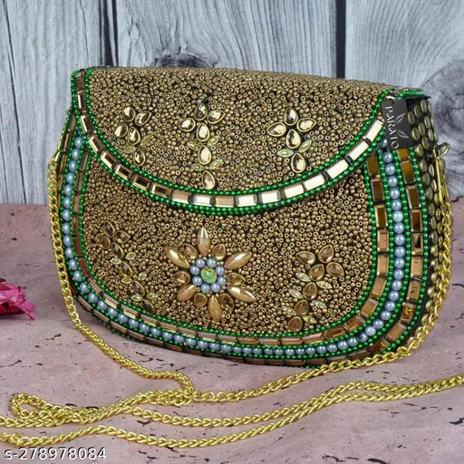 Gold-embroidered handbag with sling strap and multiple decorative elements